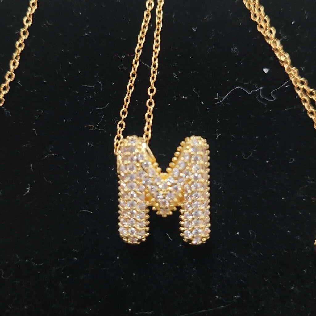 M INITIAL LETTER