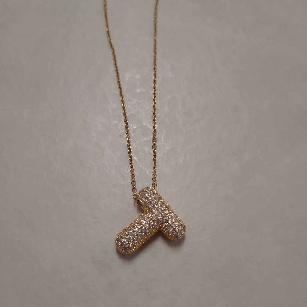 T INITIAL LETTER