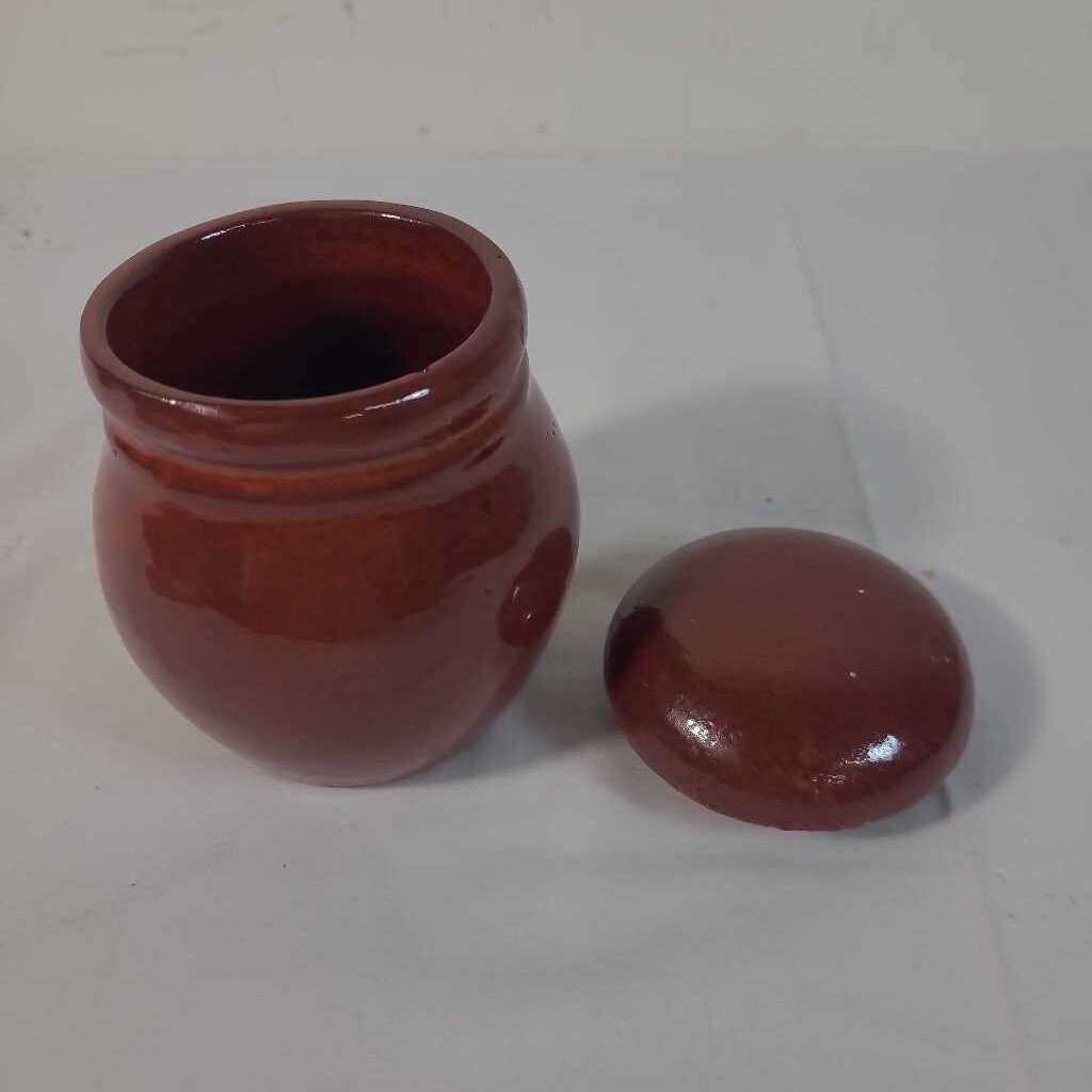 RED LIDDED POTTERY JAR