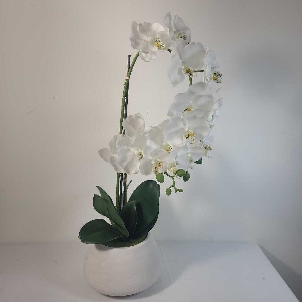 FAUX ORCHID IN A CEMENT POT