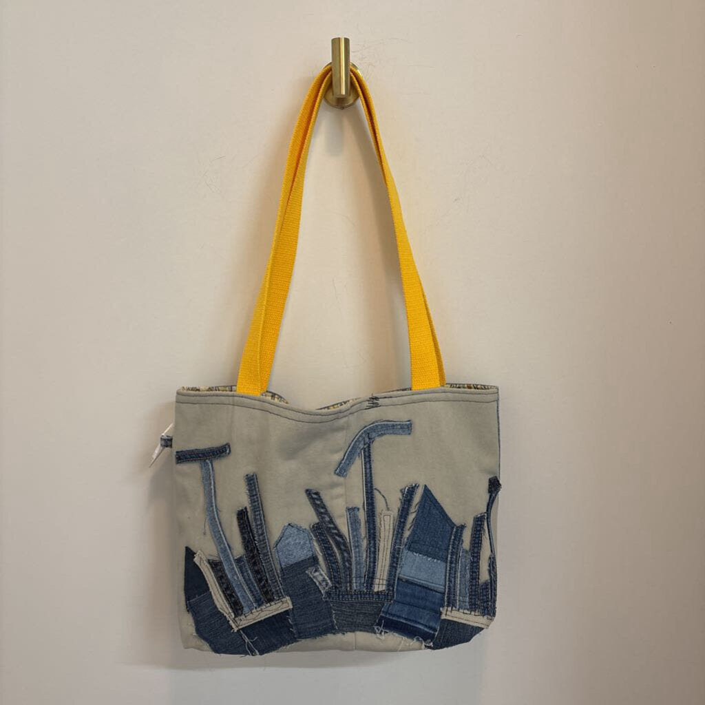 Building designs reversible tote