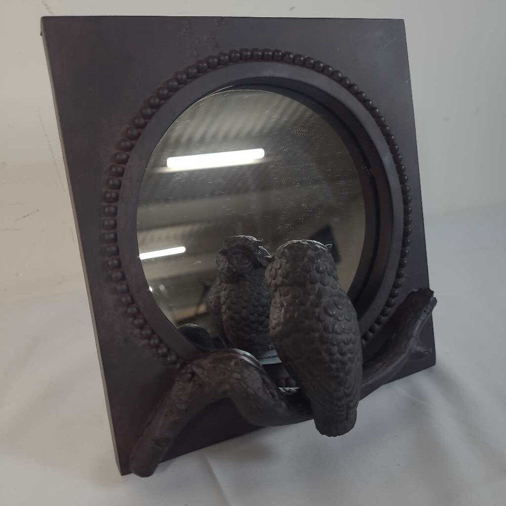TABLETOP OWL LOOKING IN MIRROR