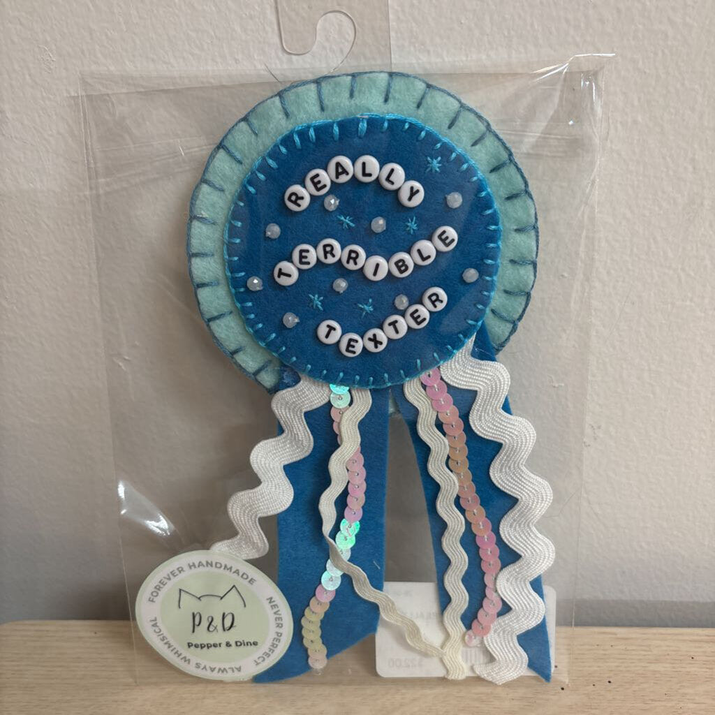 FELT PRIZE RIBBON- "REALLY TERRIBLE TEXTER"