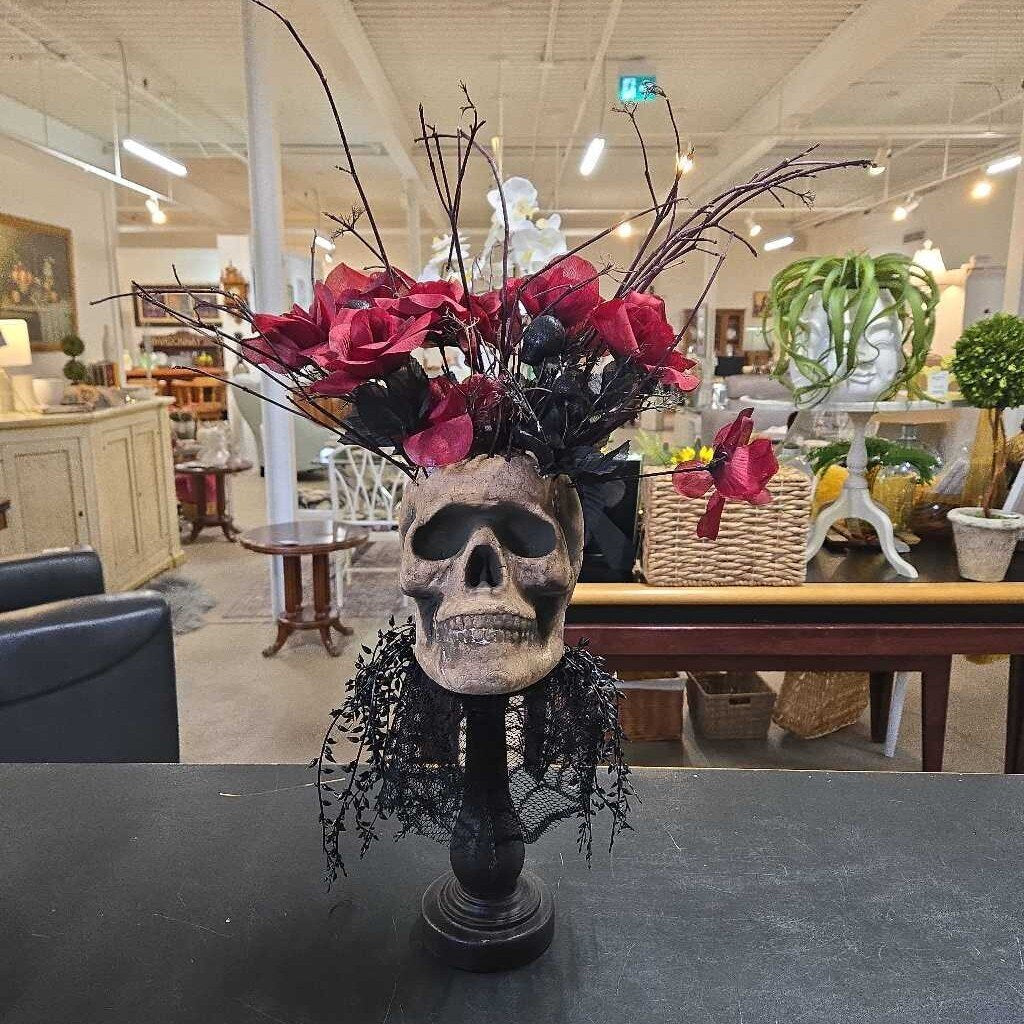 SKULL ON STAND W/RED FLOWERS