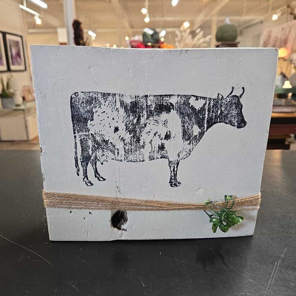 COW ON BLOCK OF WOOD