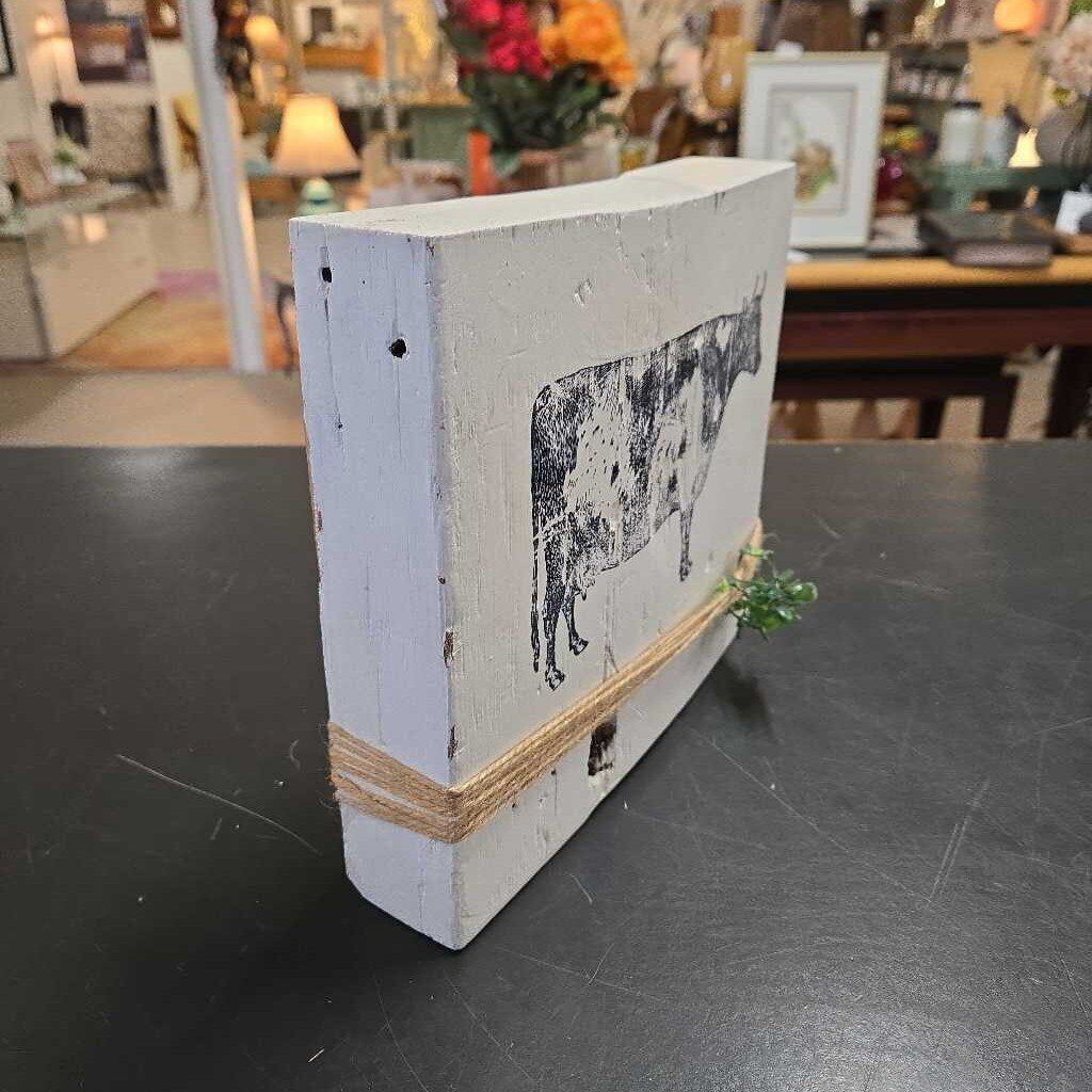COW ON BLOCK OF WOOD