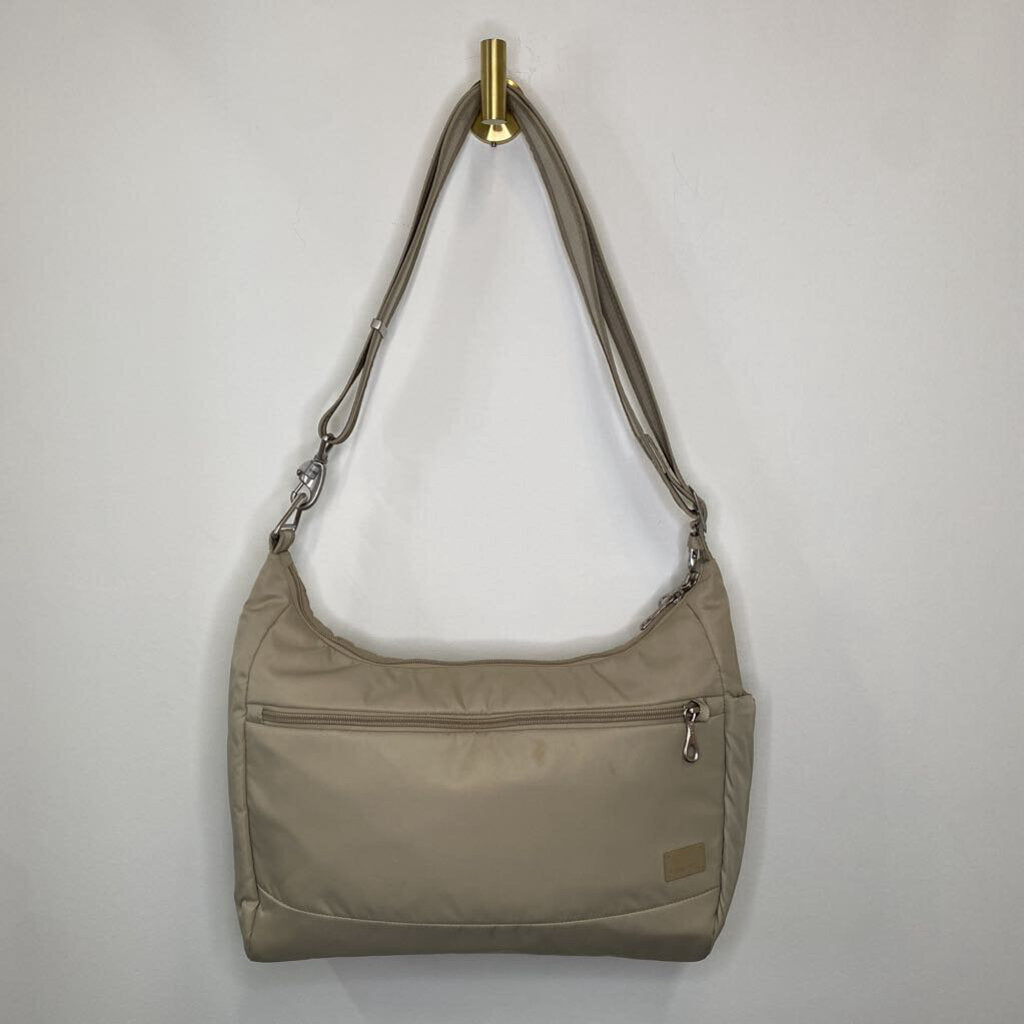 PACSAFE - BEIGE CROSSBODY BAG