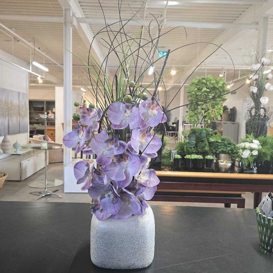 FAUX PURPLE ORCHIDS IN SILVER POT