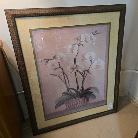 ORCHID IN A WOOD BASKET