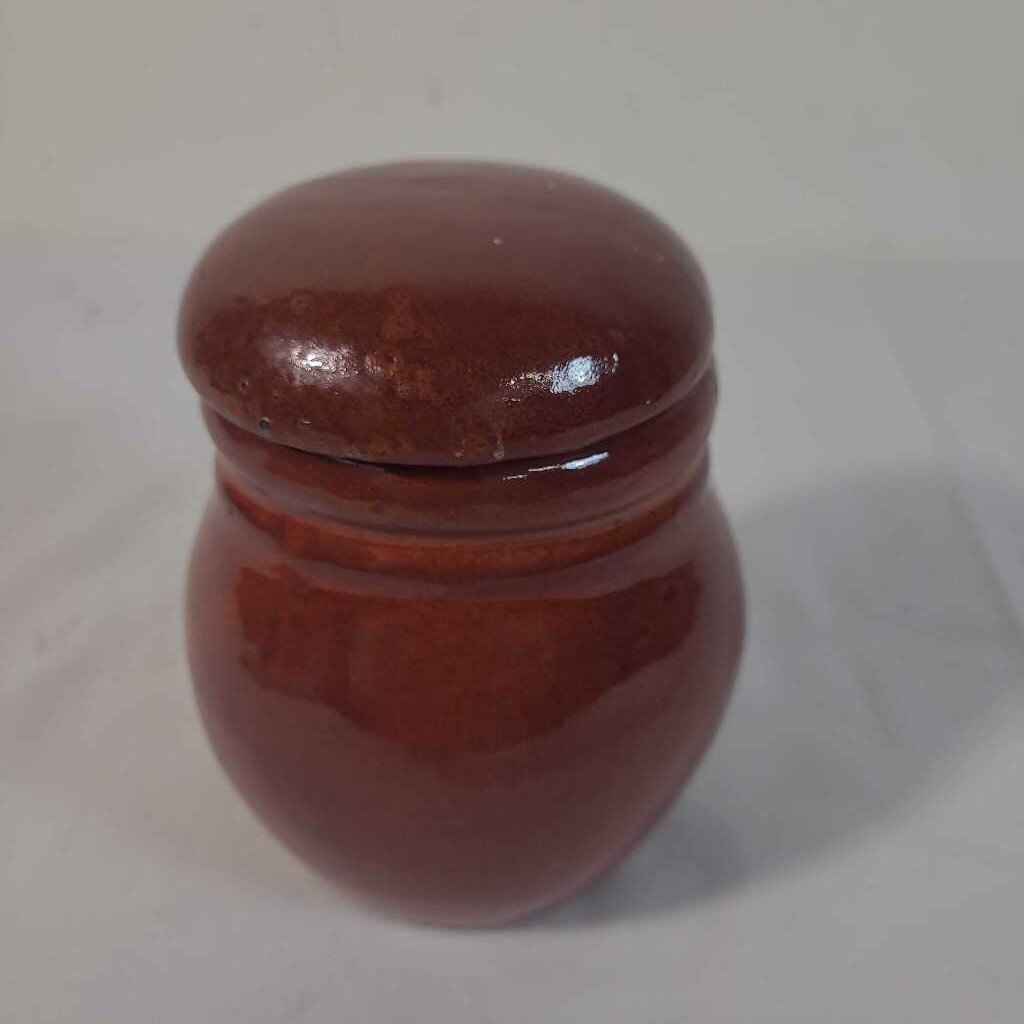 RED LIDDED POTTERY JAR