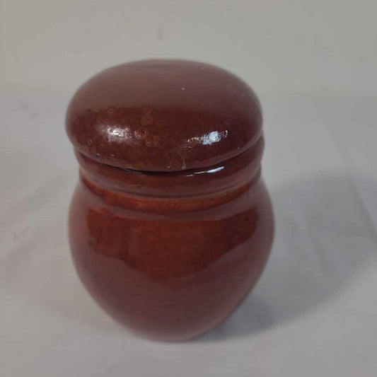 RED LIDDED POTTERY JAR