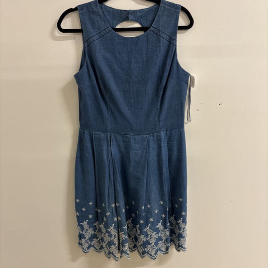 Sleeveless Denim Mini Dress with White Floral Embroidery.