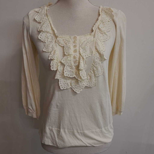 CREAM TOP WITH RUFFLES