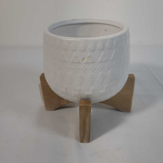 SMALL WHITE POT ON WOOD STAND