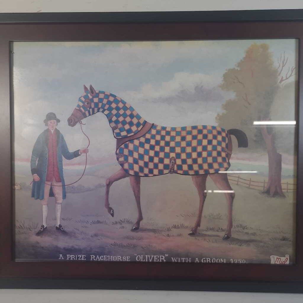 A PRIZE RACEHORSE "OLIVER" WITH GROOMER