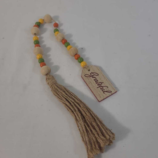 GRATEFUL TASSLE
