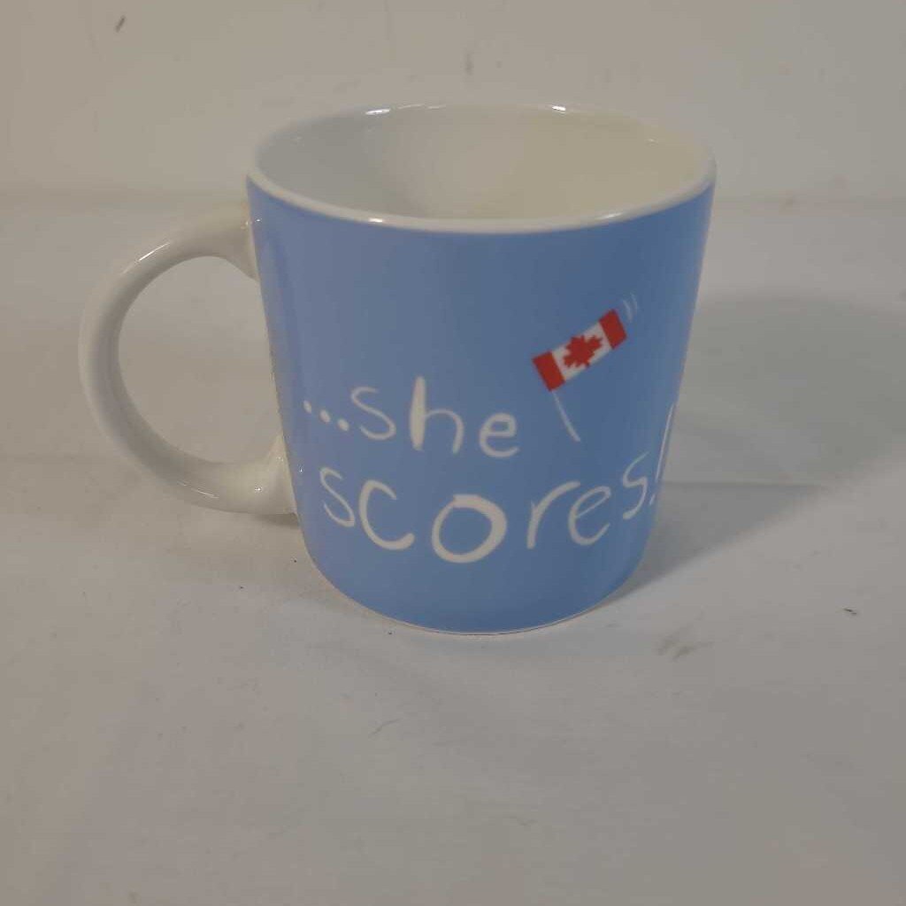 SHE SHOOTS.. SHE SCORES MUG