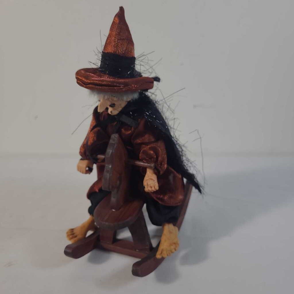 WITCH ON ROCKING HORSE